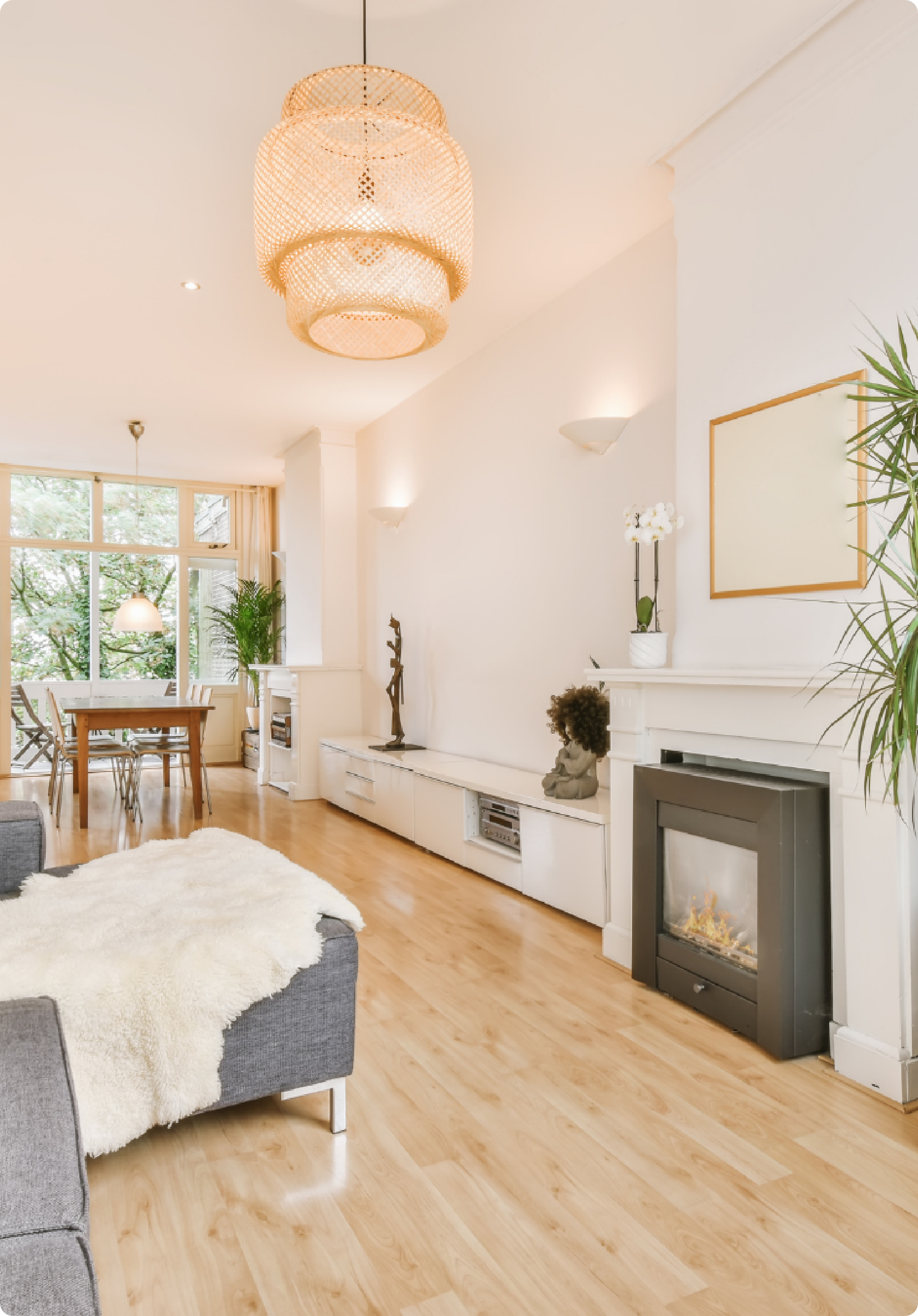 Bright home interior with chandelier and fireplace